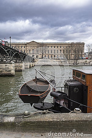 The Seine in Paris with the Louvre and a boat Stock Photo
